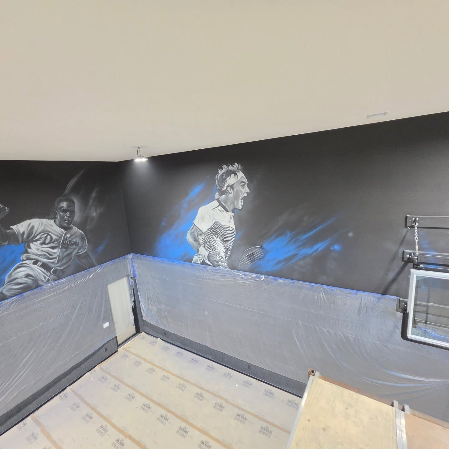 Painted baseball player in a Dodgers uniform and a tennis player mid-shout, on charcoal with blue