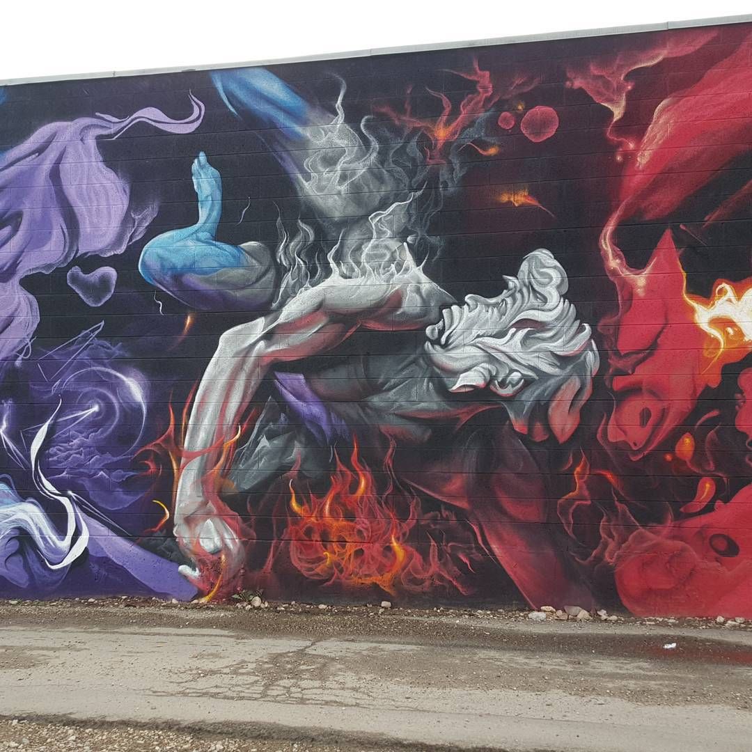Classical marble figure falling through fire between purple smoke and red flame