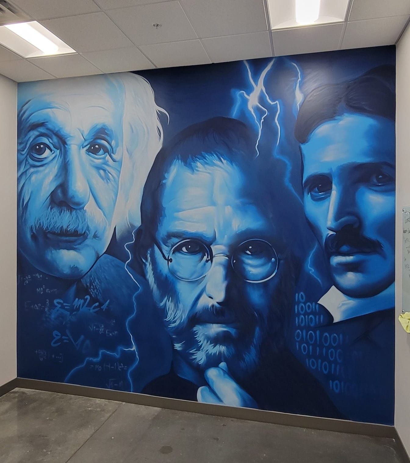 Einstein, Steve Jobs and Nikola Tesla portrait mural in blue tones on an interior office wall