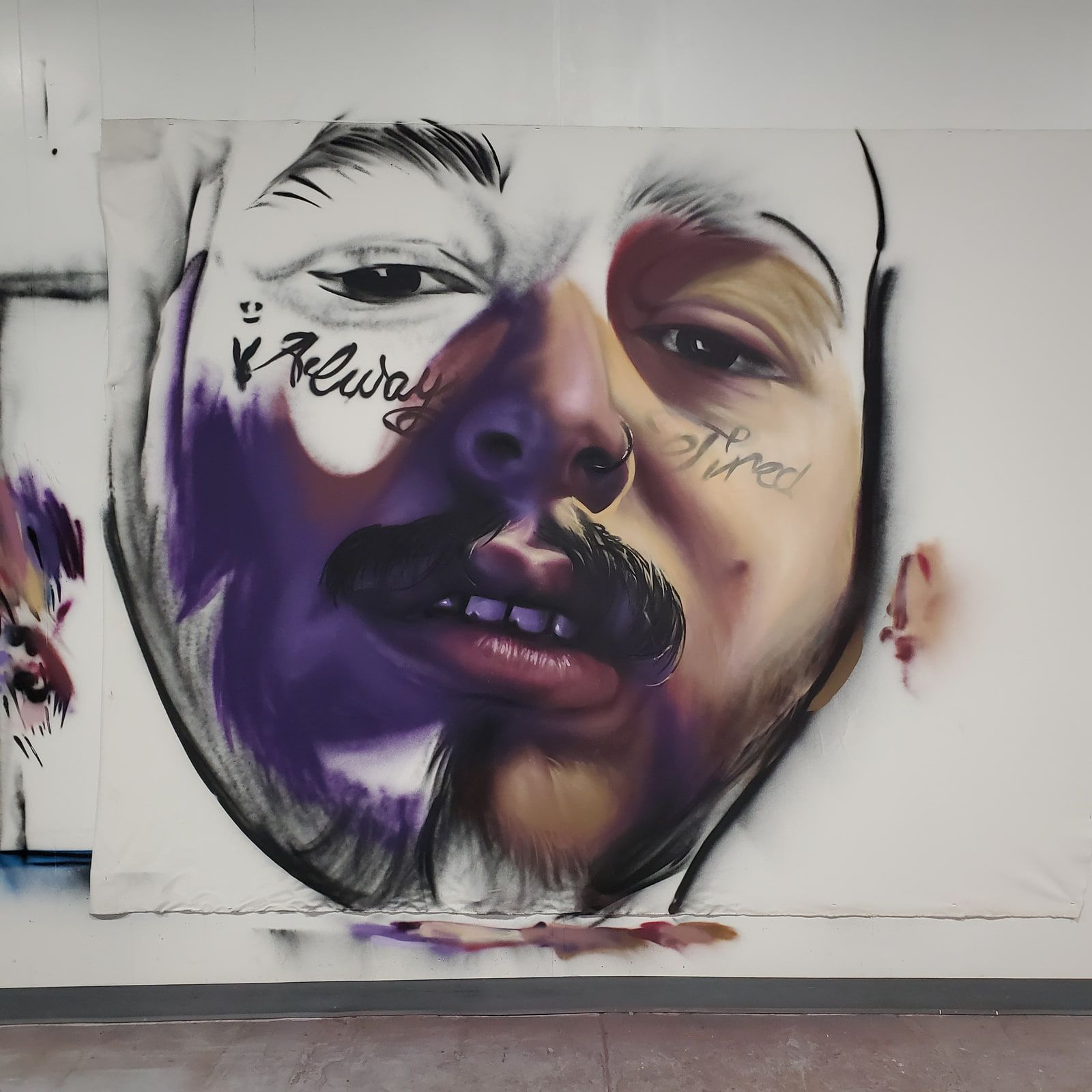 Aerosol canvas portrait of Post Malone in purple and gray, the face tattoos rendered in loose black script